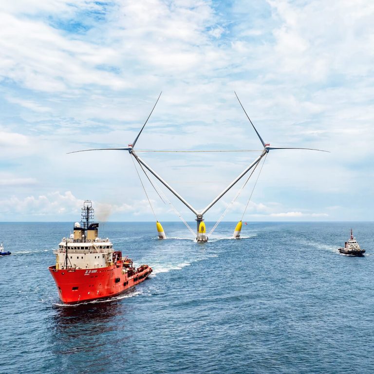 Ocean-X-floating-wind-turbine-being-towed-with-support-vessels